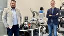 Nick Thompson, CEO of BOW, stood next to Daniel Camilleri, CTO and Founder of BOW with some robots in the background