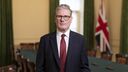 Sir Keir Starmer standing in front of a union jack flag