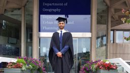 Graduate Aamir Khan standing outside the Geography Dept