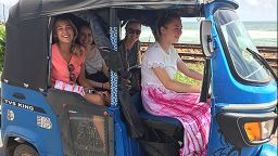 students sat smiling in a buggy whilst on placement abroad in Sri Lanka