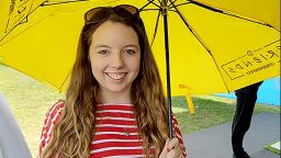 A profile photo of Jessica Williams with an umbrella.