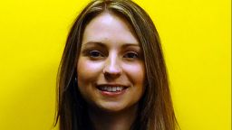A profile image of Rachael Batteson smiling in front of a yellow background