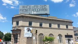 Sign in Baltimore saying 'Whoever died from a rough ride'