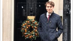 Politics graduate, Jack, is pictured stood outside of 10 Downing Street.