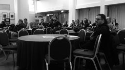 A black and white picture of a conference
