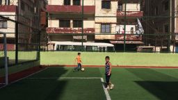 Two boys play football in Beirut