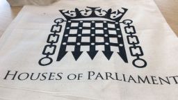 A sheet of paper with the Houses of Parliament logo