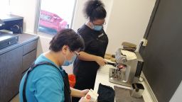 A picture of two people serving coffee