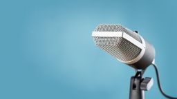 A microphone against a blue background