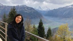 USP alumni Caia Yeung against a backdrop of mountains