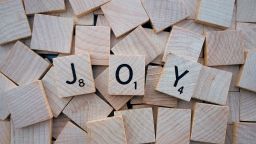 The word Joy spelt out in scrabble blocks