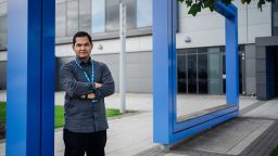 Photograph of Aiman outside the General Electric Renewable Energy offices during his industrial placement year