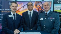 prof mohamed pourkashanian with steve gillard from boeing and paul lloyd, vice air marshall. all three stand around a piece of signed paper 