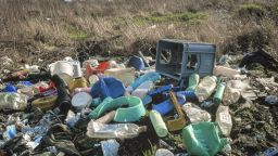 Plastic waste dumped on land outside of a city in the UK