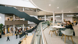 Photograph of people in the atrium of The Wave