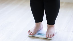 An obese person on scales 