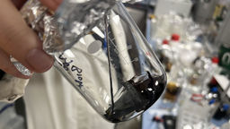 Glass beaker containing bio bitumen