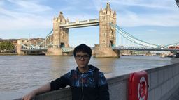 A photo of a person stood in front of Tower Bridge in London