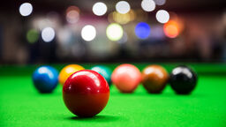 Red snooker ball on a snooker table 