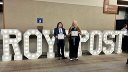 Luke and Ava holding certificates
