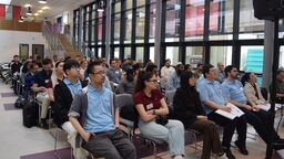 Conference attendees listening to a presentation 