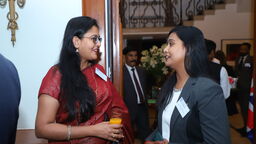 Two alumni chatting at the Alumni Reception in India