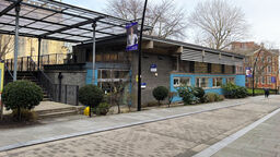 A front view of the Belonging Building showing the main entrance